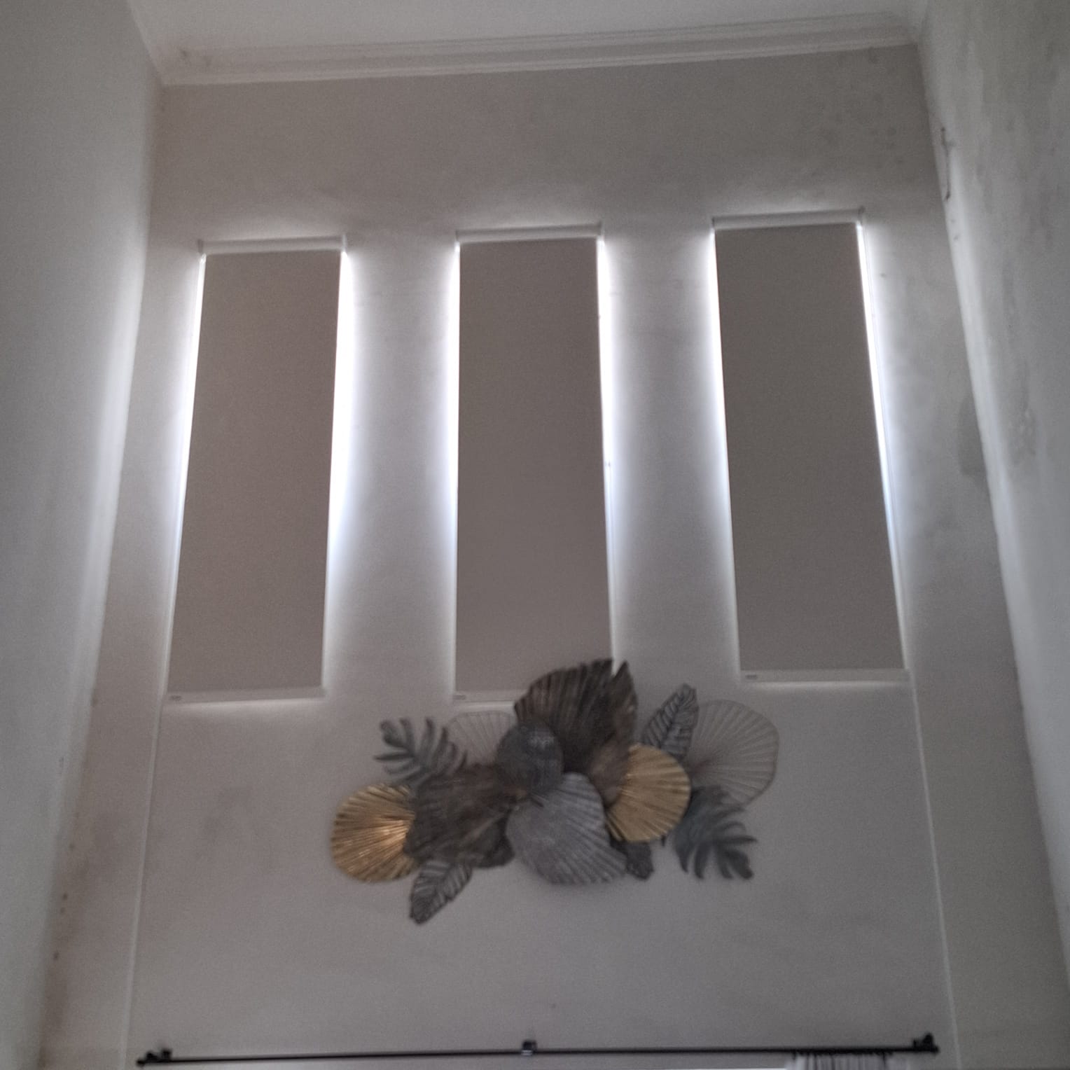 Black Out roller blinds blocking sunlight in a bedroom