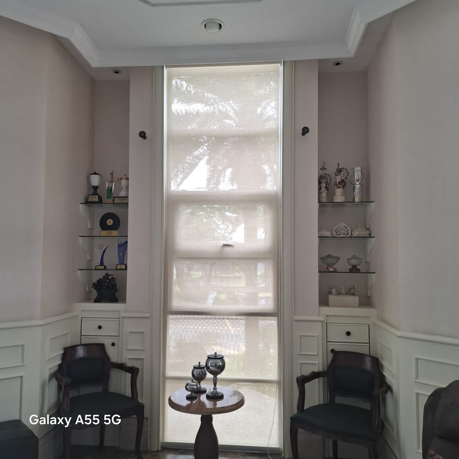 Dim Out roller blinds in a cozy living room with soft filtered light